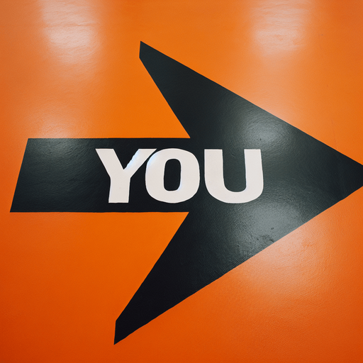 A big black horizontal arrow pointing left with centred text 'YOU' in capital letters, painted on an orange floor..
horizontal and pointing left