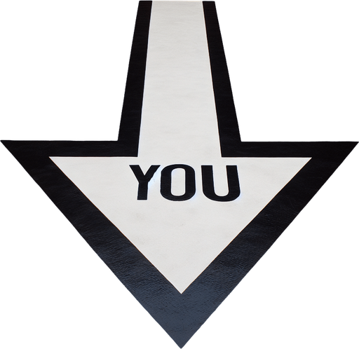 A big black horizontal arrow pointing left with centred text 'YOU' in capital letters, painted on an orange floor..
horizontal and pointing left