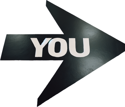 A big black horizontal arrow pointing left with centred text 'YOU' in capital letters, painted on an orange floor..
horizontal and pointing left